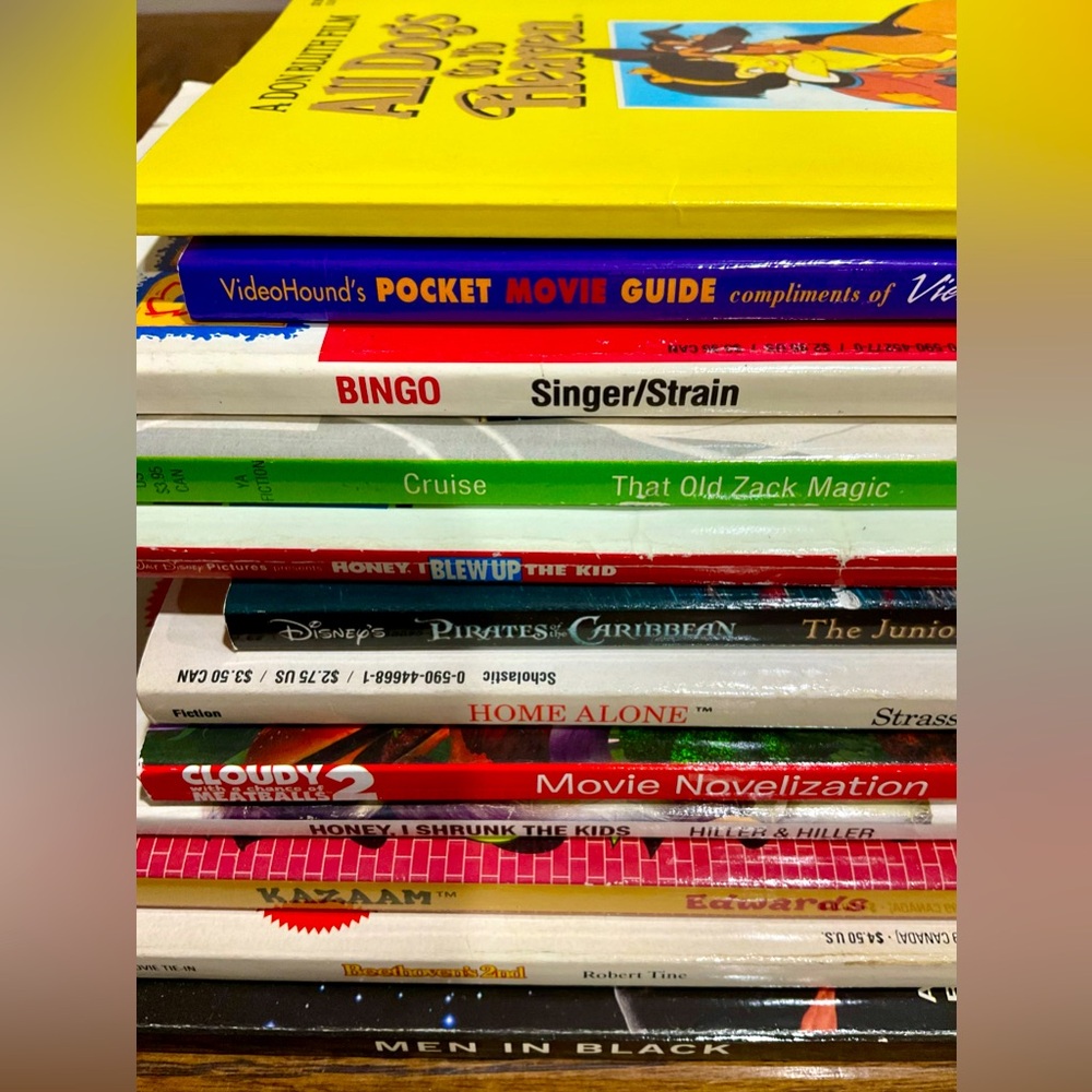 12 movie novels book: MIB Beethoven Pirates Zack Dogs Home Alone Kazam Meatballs